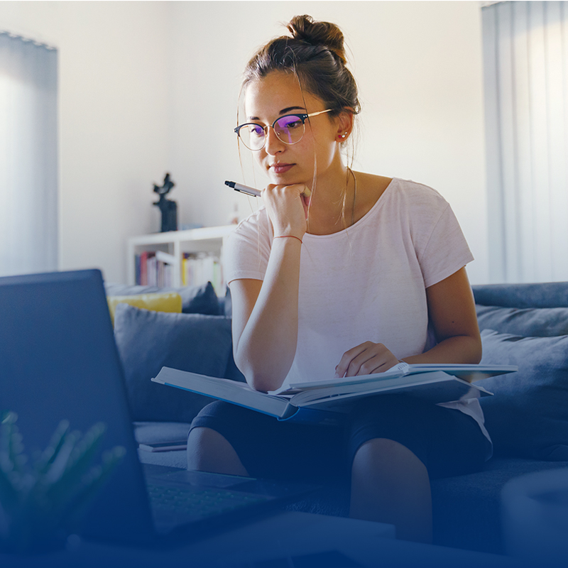 young-woman-with-glasses-hand-on-chin-looking-at-computer