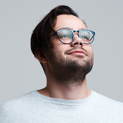 confident-man-with-glasses-looking-up confident-man-with-glasses-looking-up